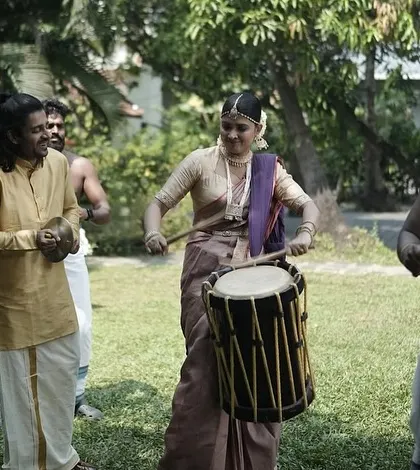 Even in candid, joyful moments like playing the chenda drums, the bride's makeup remains flawless. I use professional techniques and products to ensure the look is durable and withstands all the emotions and activities of the day.