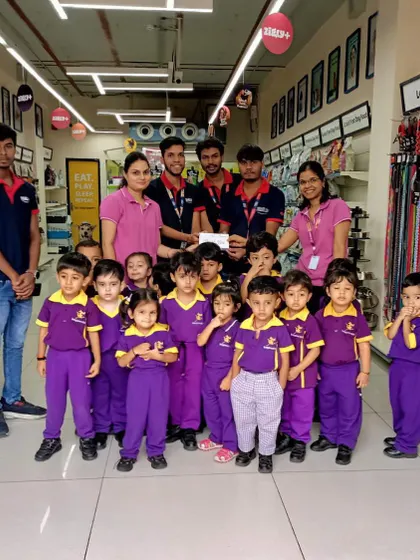 The schoolchildren pose for a group photo with our Indore store team, a wonderful initiative to foster compassion for animals.