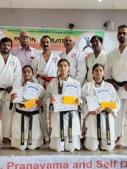 The winners of the Indian Karate Karnataka team holding their certificates and cash awards from the BMN Trust.
