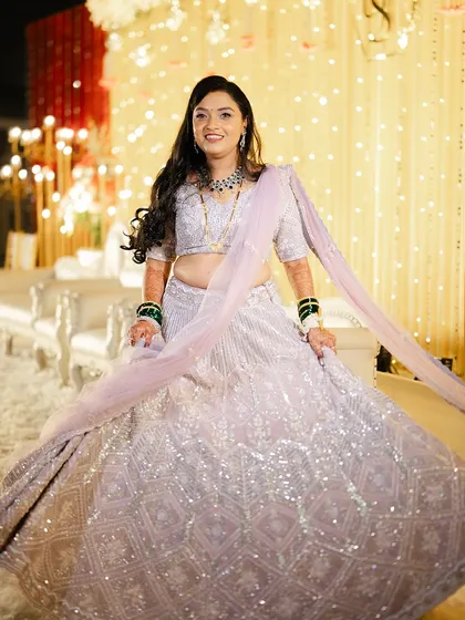 The bride twirling in her beautiful lavender lehenga, looking absolutely ethereal.