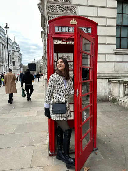 The classic tourist photo with a London telephone booth. My black and white outfit creates a great color contrast with the iconic red booth.