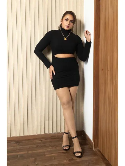 The full-length shot of the black cutout dress, proving that a little black dress is always a good idea.