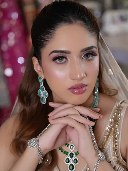 Another shot from the soft romantic glam series. The focus is on glowing skin, soft pink eyeshadow, and glossy lips for a fresh and modern bridal aesthetic.