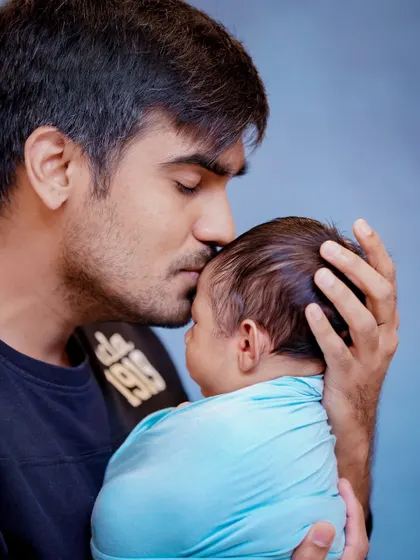 The gentlest of kisses. A father's love for his newborn is a powerful and tender thing to witness, and I am honored to capture it.