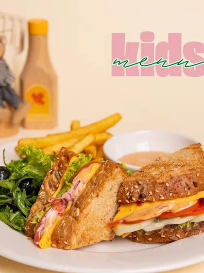 A hearty and delicious sandwich from our kids' menu, served with a fresh side salad and fries.