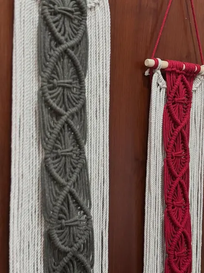 The intricate diamond pattern on these wall hangings is created with careful knotting. It's a beautiful example of macrame craftsmanship.