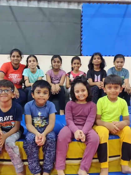 This image is a duplicate of 36, showing a proud group photo of our students and a coach. We are a close-knit team, and we love celebrating the hard work and progress of every child.
