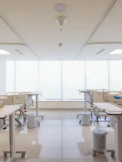 This multi-bed ward is designed with large windows to ensure every patient has access to natural light. The layout is clean and organized, prioritizing both patient comfort and operational efficiency for the medical staff.