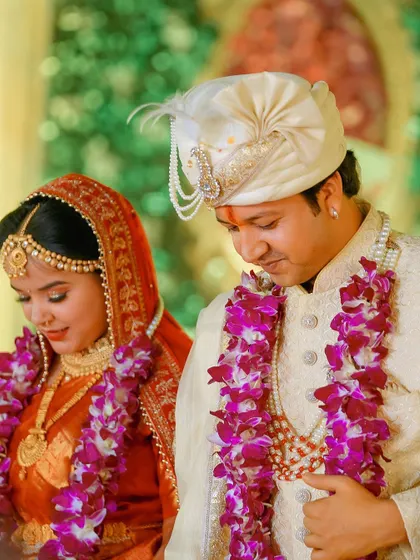 A close-up of the couple during a wedding ritual. Their focused and serene expressions show the solemnity and importance of the moment.