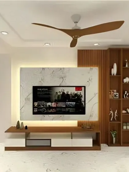 A clean and modern TV unit with a marble-finish back panel and wood accents. The design includes open shelving on the side for displaying decorative items.