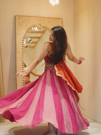 The back view of a Garba twirl, showing how the lehenga flows. It's all in the details.