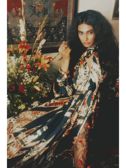 Movement and stillness combine in this shot from "Roots." The flowing dress and floral arrangement represent the flourishing that comes from being deeply grounded, a core idea of this visual storytelling project.