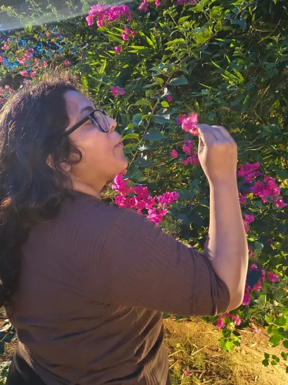 A self-portrait interacting with bougainvillea flowers at golden hour. This series is about finding moments to blossom and appreciate the beauty around us.