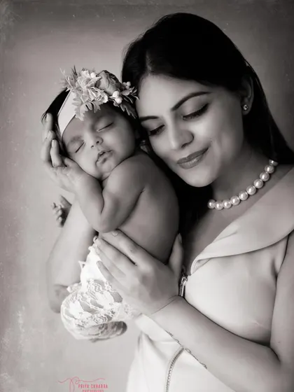The quiet magic between a mother and her newborn. This classic black and white portrait highlights the soft light and even softer love in this timeless moment of motherhood.