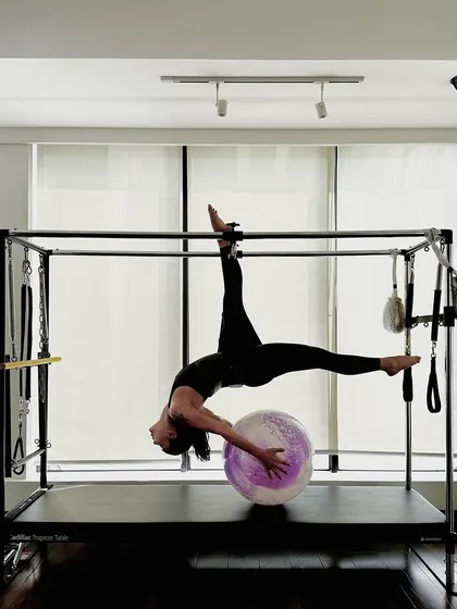 A final shot of this stunning pose, capturing the beauty and power of advanced Pilates.