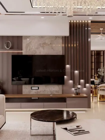 A view focusing on the custom media unit, which integrates wood paneling, marble, and ambient backlighting. This functional element is designed to be a beautiful focal point, blending storage with high-end aesthetics.
