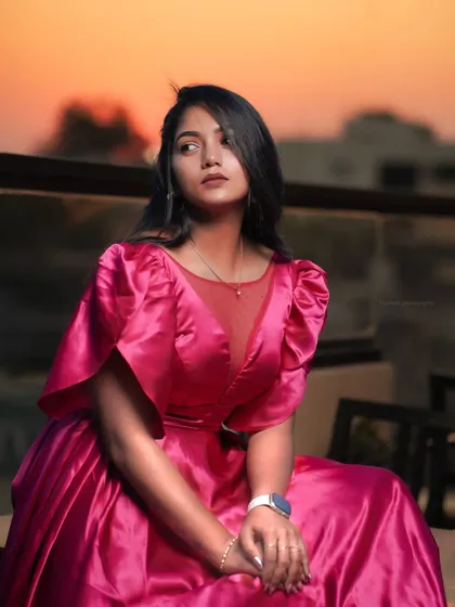 A sunset portrait with a focus on the beautiful colors in the sky. This is a perfect example of using natural light to its fullest potential.