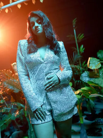 A moody shot from a music video set. I can adapt my look and performance to match the specific aesthetic of your song.