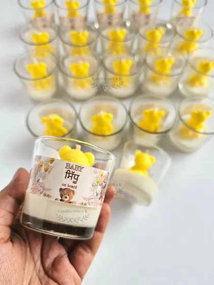 A close-up of the personalized "Baby on Board" sticker for the teddy bear candles, showing how we can match the design to your theme.