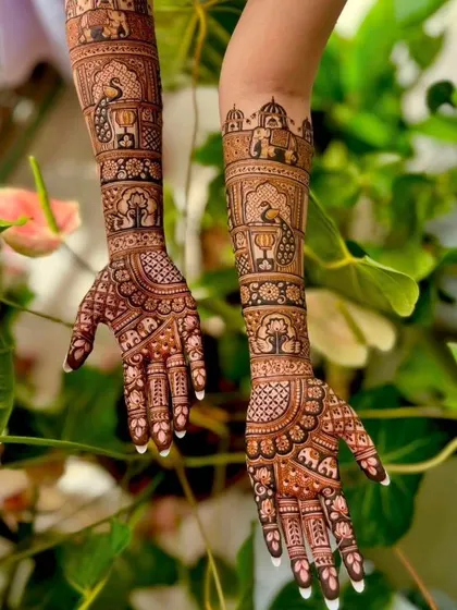 A beautiful design with a nature-inspired theme, featuring trees, peacocks, and elephants, set against a leafy background.