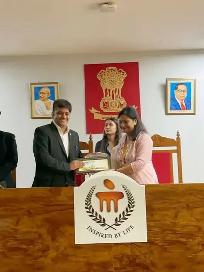 Receiving a memento from the faculty at Manipal University after an engaging session with their law students.