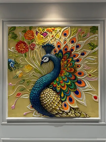 A direct, well-lit shot of the peacock mural, showcasing the brilliant blues, greens, and oranges, and the intricate texture of each individual feather.