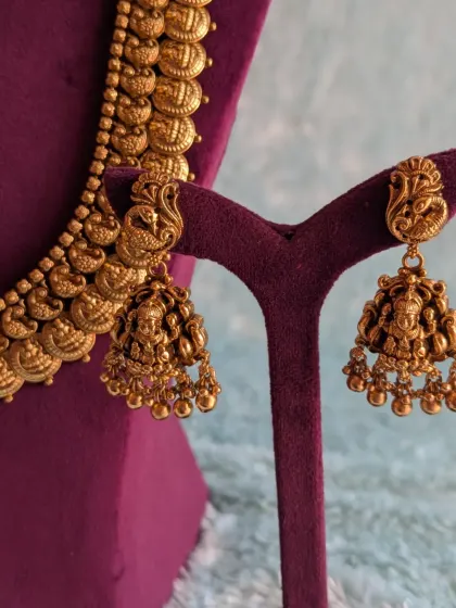 A close-up of the beautiful peacock and Lakshmi motif jhumkas that are part of my Kaasu necklace set. These earrings can also be mixed and matched with other necklaces.