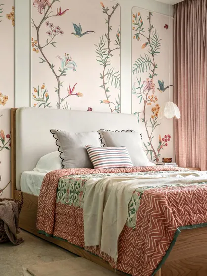 Soft pastels and a beautiful floral mural create a fresh and energetic feel in this daughter's room. The design is refined yet playful, perfect for a growing child.