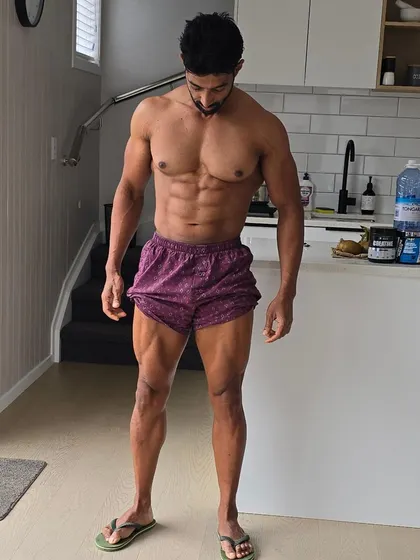 A vacuum pose to check core control and ab definition. This is an old-school technique that is highly effective.
