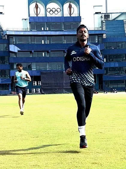 An athlete running on the field at the stadium. There is no substitute for practicing speed in the environment where it matters most.