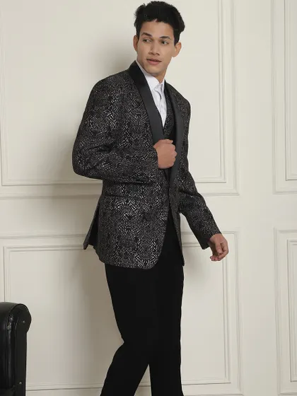 This black and silver patterned suit jacket is perfect for a man who isn't afraid to make a statement.