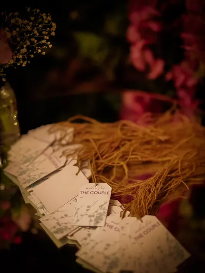 Personalized tags for the wishing well, allowing guests to write their heartfelt messages for the couple. It's these small, thoughtful details that make a celebration memorable.
