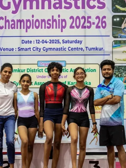 Our gymnasts and coaches posing at the Gymnastics Championship. This image captures the strong bond and shared goal of achieving success at the highest levels of the sport.
