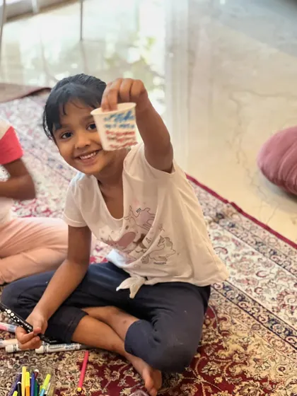 Another big smile from a proud creator and her magical doll.