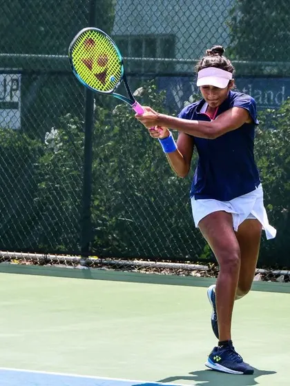 Sahaja unleashes a forehand during the ITF W100 tournament, a testament to her aggressive and skillful play.