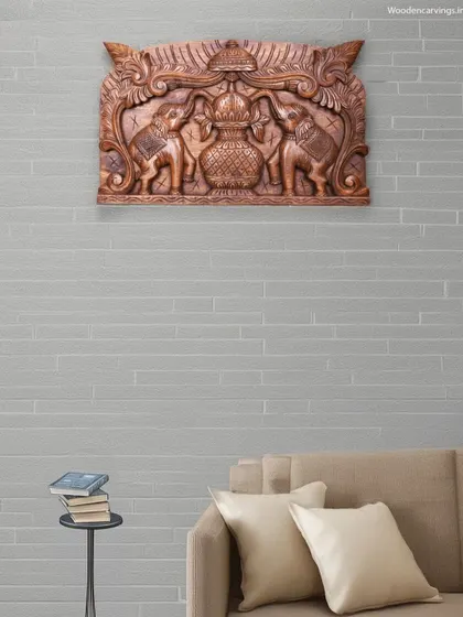 This 24-inch Pooja Gopura Kalasam panel features two elephants anointing a sacred pot. It is an auspicious symbol, perfect for hanging at the entrance of a home or pooja room.