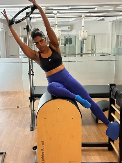 A beautiful side-body stretch on the Ladder Barrel using the Pilates ring, which helps to open up the obliques and improve spinal flexibility.