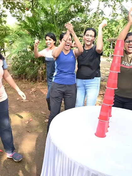 The thrill of victory during a team-building game. I organize a variety of activities, like this cup-stacking challenge, that are simple, fun, and perfect for getting everyone cheering for their colleagues.