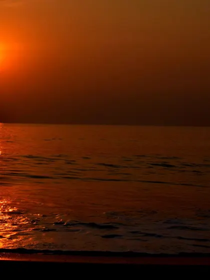 A vertical shot of the beautiful sunset in Gokarna, perfect for capturing the serene end to an adventurous day.