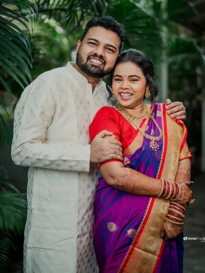 A bright and happy portrait of the couple. Their beaming smiles and comfortable embrace reflect the joy and excitement of their engagement.