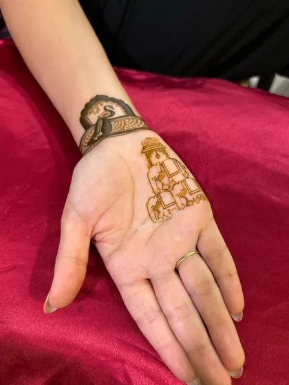 A simple yet adorable design featuring two elephants, perfect for adding a touch of tradition to any henna design.