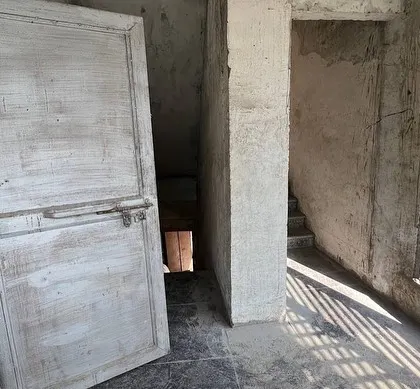 The state of the interior before our intervention, showing the raw, unfinished spaces we had to work with.