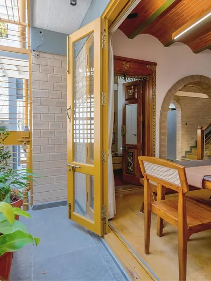 A view from the dining area towards the entrance, showing the flow created by the series of arches.