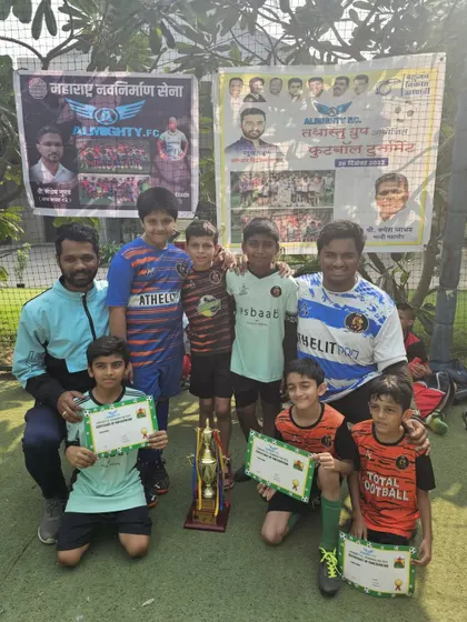 The U11 championship team celebrating their victory at the Almighty FC tournament.
