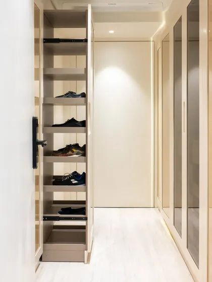 A pull-out shoe rack is a wonderfully efficient way to store and access your footwear. This tall, narrow unit makes use of vertical space, keeping shoes organized and off the floor.