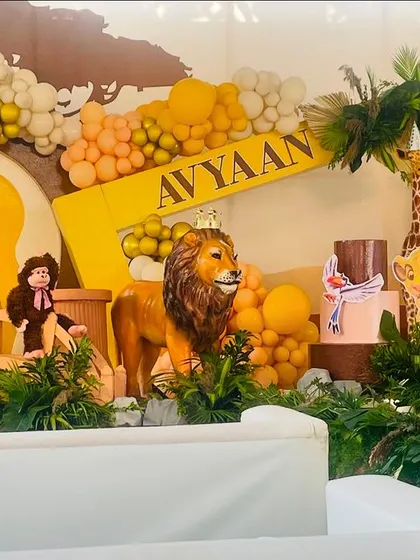 Another angle of the vibrant Lion King first birthday setup, showing the detailed props and lush greenery that made the jungle theme feel immersive and exciting.