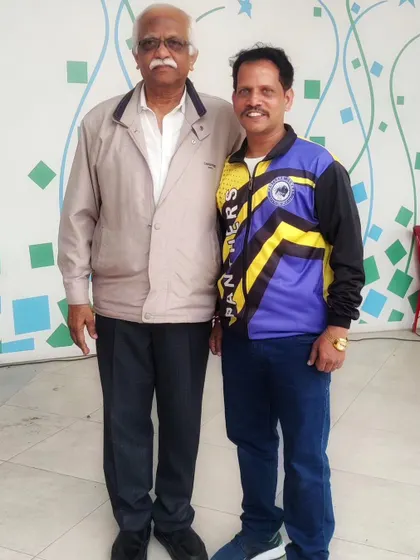 Standing with a respected member of the community. Building strong relationships is key to our club's philosophy.