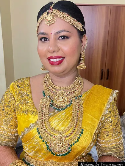 A full-face portrait showing the beautiful details of this muhoortham makeup. The look is traditional, radiant, and perfect for the main ceremony.