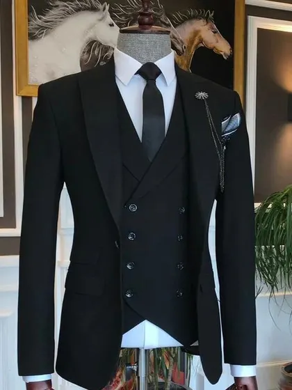 A timeless black three-piece suit. This is the most essential formal wear for any man, and I ensure the fit is absolutely perfect.