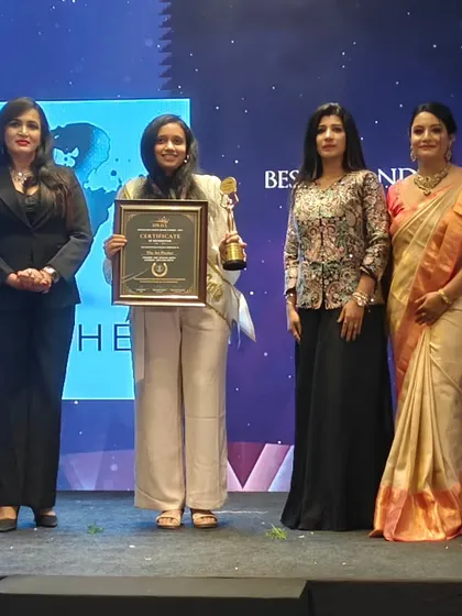 On stage receiving the Best Art Entrepreneur award. Moments like these are a powerful motivation to keep pushing forward, innovating, and sharing the positive impact of art.